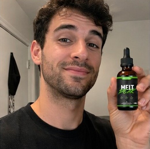 MeltPeakDrop customer holding a bottle, photo 6
